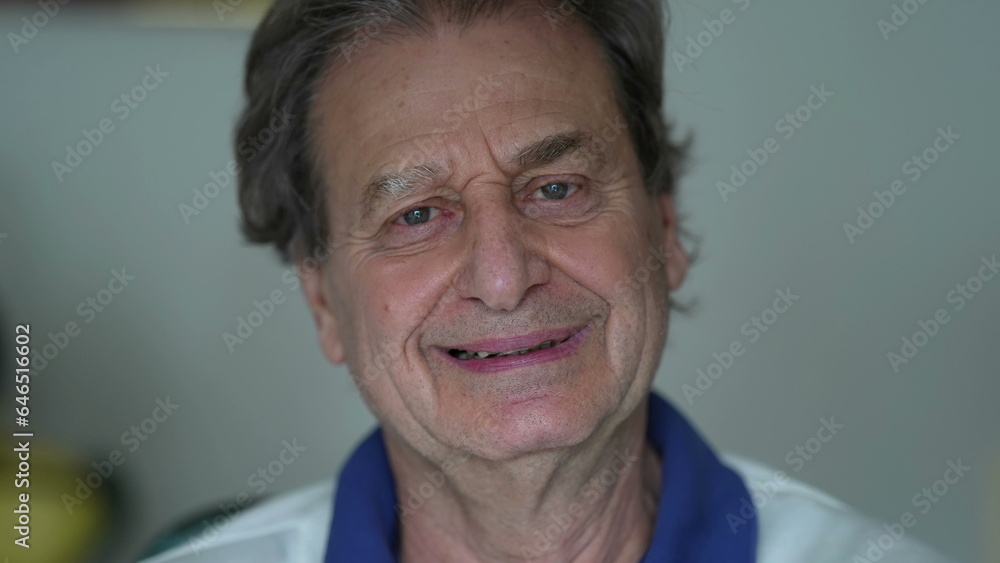 Happy senior man laughing and smiling, close-up face of retired elderly joyful male caucasian person in 70s with friendly demeanor Happy senior man laughing and smiling, close-up face of retired elderly joyful male caucasian person in 70s with friendly demeanor