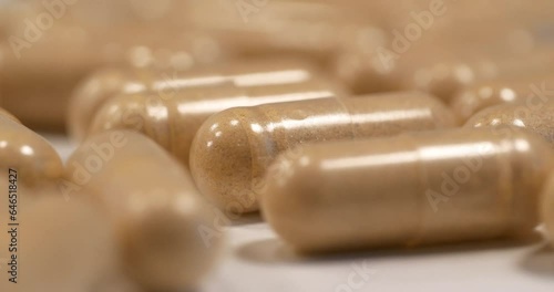 Vitamins or nutritional supplements in capsules. Drug Production. Pharmaceutical shop for medicine production. Cinema 4K 60fps extreme close-up macro video photo