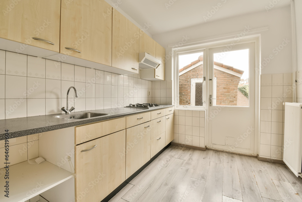 Empty kitchen with wooden cabinets and counter Empty kitchen with wooden cabinets and counter