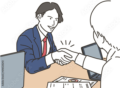 握手をする笑顔のビジネスマン
