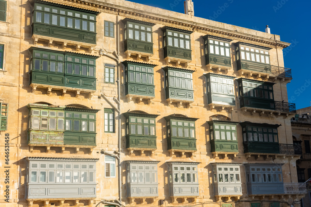 Traditional colorful maltese balconies (Gallarija) on a building in Valletta old town, Malta Traditional colorful maltese balconies (Gallarija) on a building in Valletta old town, Malta