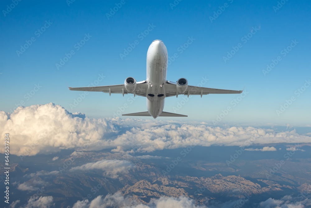 Airplane climb flight from airport. Passenger airplane is flying over amazing mountains. Travel by air transport Airplane climb flight from airport. Passenger airplane is flying over amazing mountains. Travel by air transport