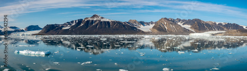Stunning landscapes with jagged mountain peaks, glaciers and icebergs along the shores of the Liefdefjorden, Northern Spitsbergen, Svalbard, Norway © Luis