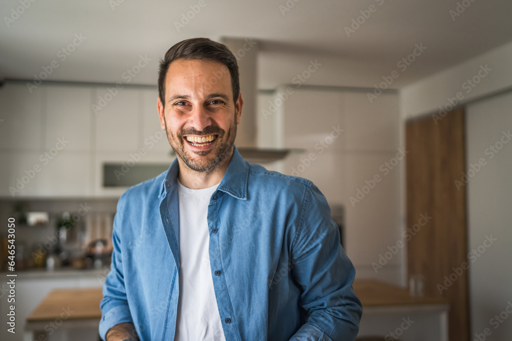 One adult man with eyeglasses stand at home happy smile