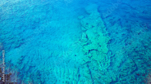 Aerial image of amazing submerged rocks near the sea surface at the Korcula island, Croatia, perfect for diving