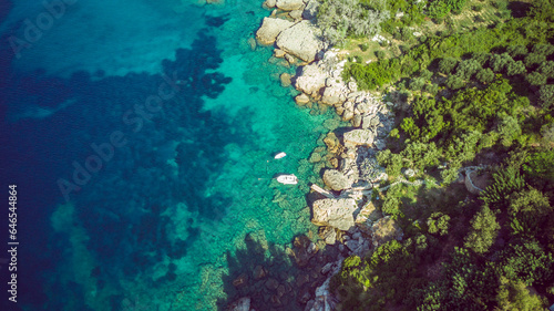 Aerial view of amazing shoreline at the Mokalo beach near town of Orebic on Peljesac peninsula, Croatia, with large stone rocks partially submerged in turquise sea water