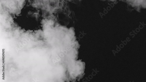 Smoke Flow Fills the Bblack Screen. A swirling stream of white smoke gradually fills the black background. Great for creating creative transitions between plots photo