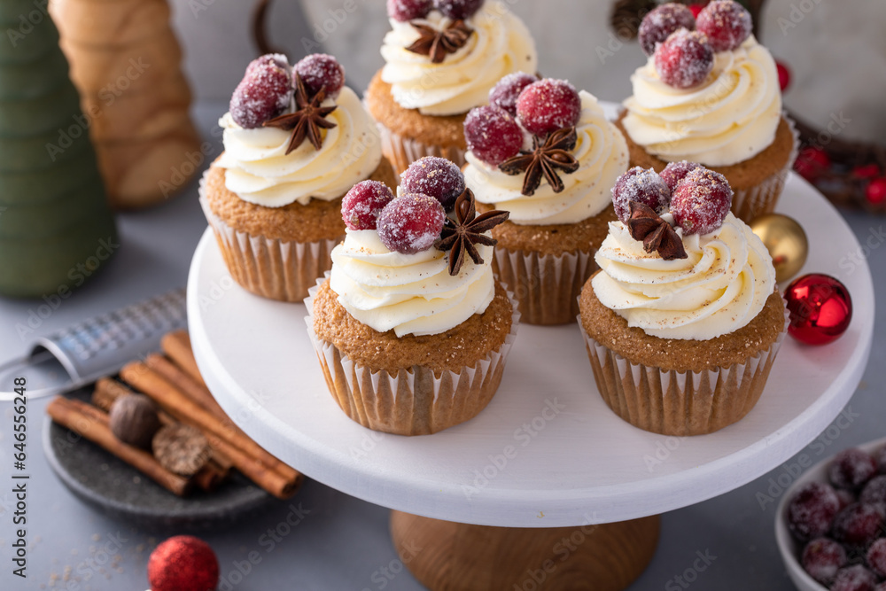 Spiced cinnamon and cranberry cupcakes topped with sugared cranberries for Christmas or Thanksgiving