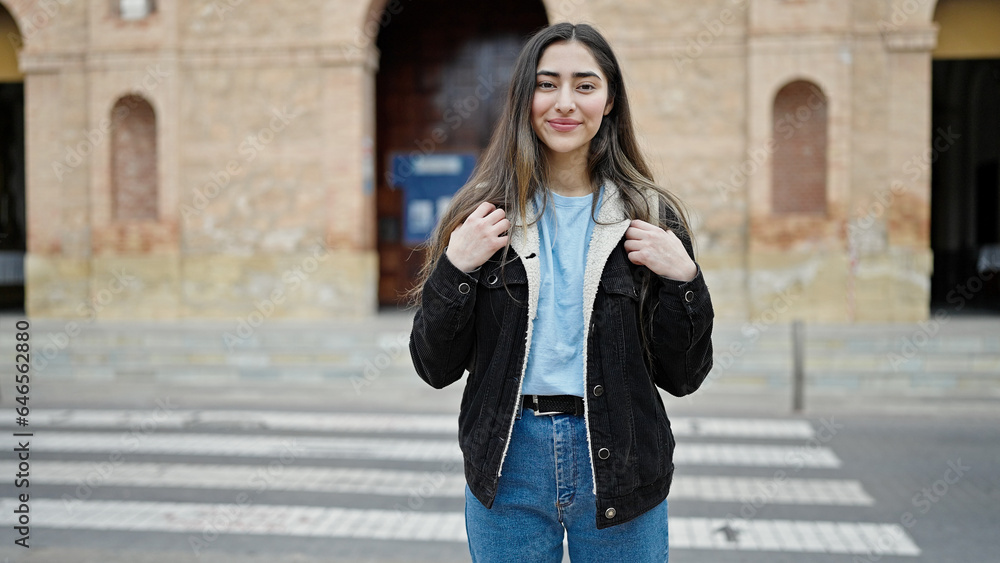 Young beautiful hispanic woman student smiling confident standing at street Young beautiful hispanic woman student smiling confident standing at street