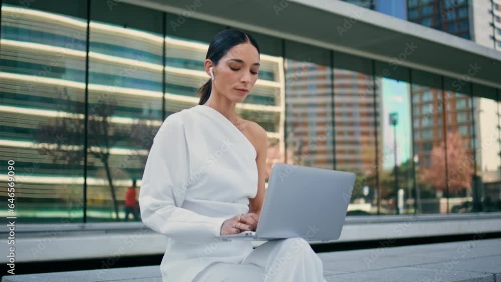 Business woman sitting street bench working on laptop close up. Lady freelancer Business woman sitting street bench working on laptop close up. Lady freelancer