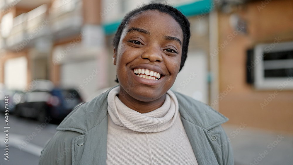 Obraz premium African american woman smiling confident standing at street