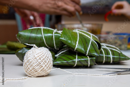 Fotografija Hallacas or Tamales, typical dish wrapped in banana leaves and different filling