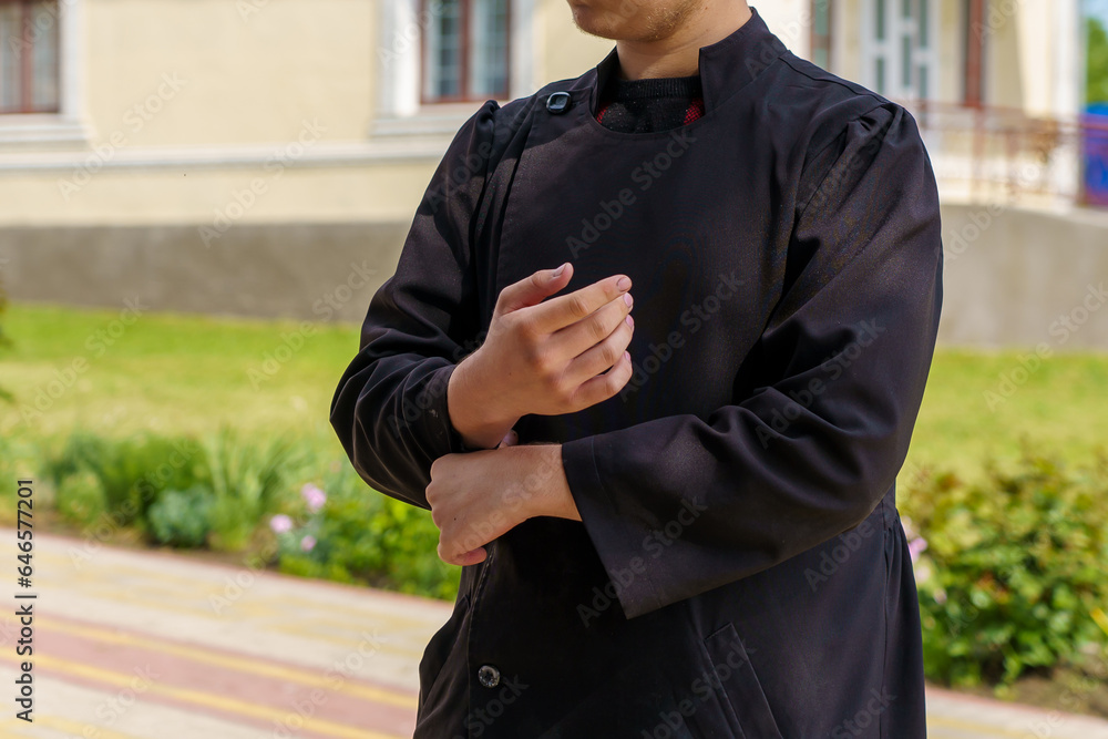 Fototapeta premium Young clergyman. Background with selective focus and copy space