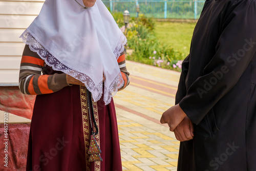 Traditional clothes of a religious mother in the church. Background with selective focus and copy space