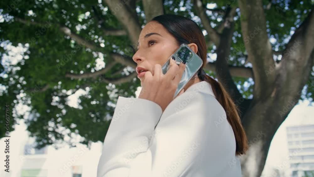 Luxurious woman speaking telephone walking under tree close up. Lady calling Luxurious woman speaking telephone walking under tree close up. Lady calling