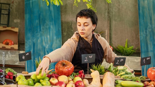 Photos Woman stand holder wearing apron running farmers market counter, selling natural organic products to clients