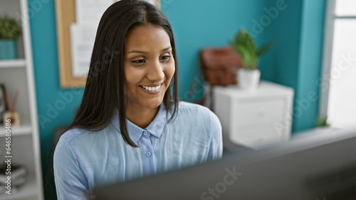 Young latin woman business worker using computer working at the office Free Download Young latin woman business worker using computer working at the office - GFXLoad