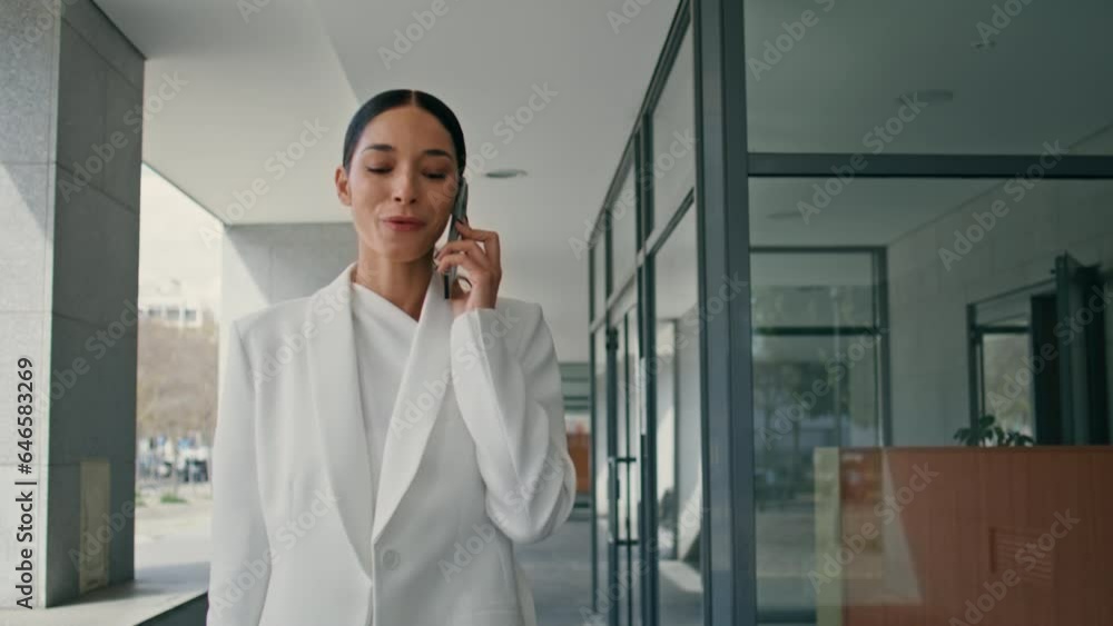 Young female director calling walking on business center close up. Lady talking Young female director calling walking on business center close up. Lady talking
