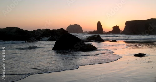 Scenic landscape of sea stacks at Bandon beach against sunset in Oregon state. photo