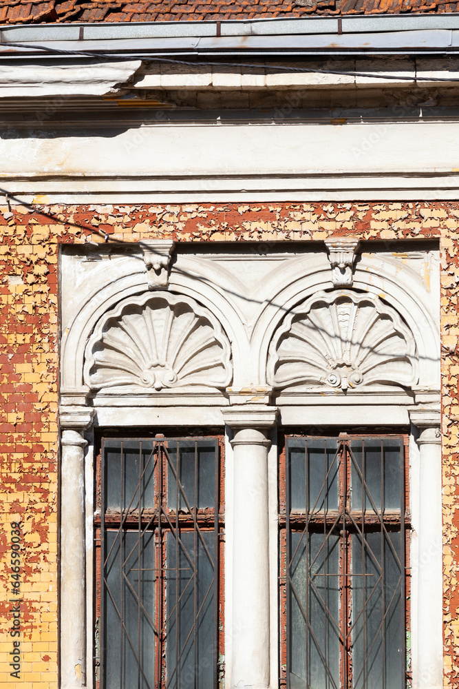 Windows of a very old house. Conservation of historical architecture. Close-up. Frontal view.