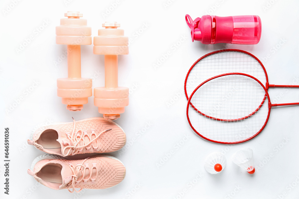 Obraz premium Set of sports equipment with shoes on white background