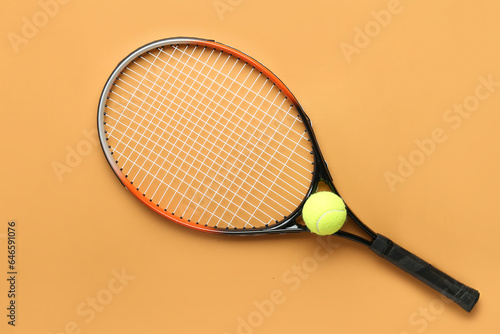 Tennis racket with ball on color background © Pixel-Shot