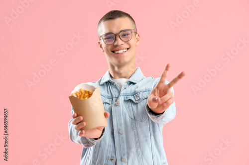 Young man with french fries...