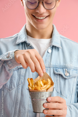 Young man with bucket of fr...