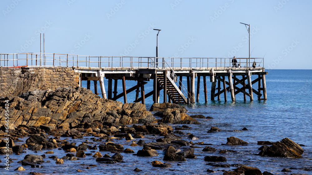 The iconic Second Valley jetty with a man fishing located on the Fleurieu Peninsula South Australia taken on September 11th 2023