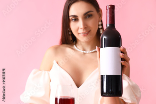 Young woman with glass and ...