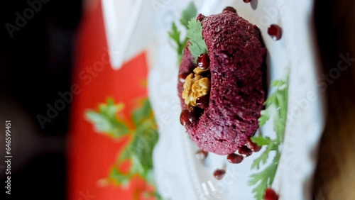 Pkhali traditional Georgian food. Beetroot is used for the purple color. Walnut is used for decoration photo