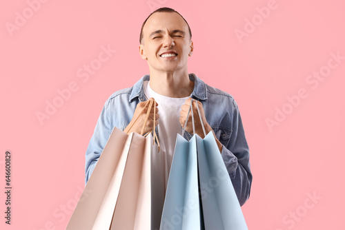 Young man with shopping bag...