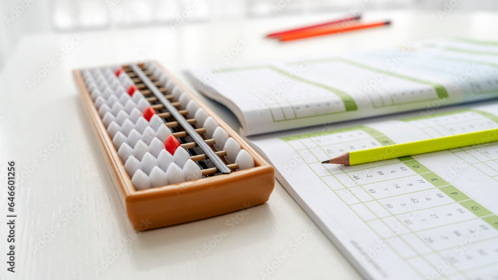 The boy is engaged in abacus, mental arithmetic for children The boy is engaged in abacus, mental arithmetic for children