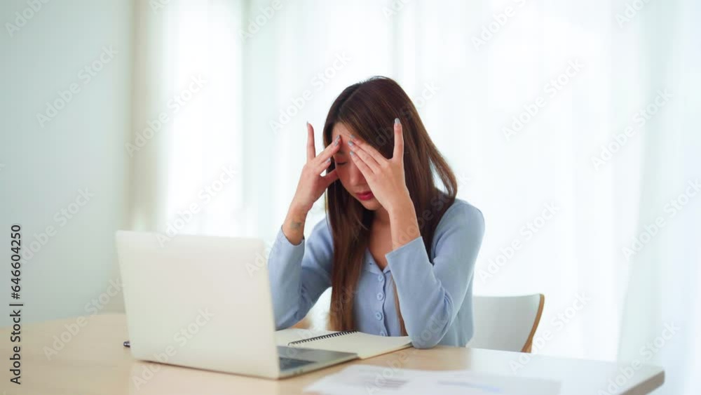 Office syndrome. Overworked tired young asian woman feeling headache, having eyesight problem after computer laptop work. Stressed young woman suffering from fatigue at home Office syndrome. Overworked tired young asian woman feeling headache, having eyesight problem after computer laptop work. Stressed young woman suffering from fatigue at home