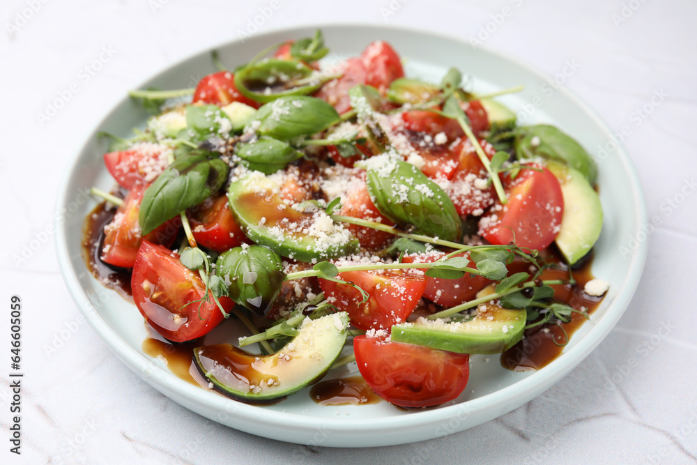 Tasty salad with balsamic vinegar on white textured table Tasty salad with balsamic vinegar on white textured table