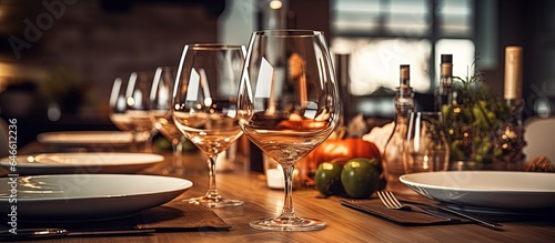 Fototapeta Naklejka Na Ścianę i Meble -  Set table for family dinner with wine glass.