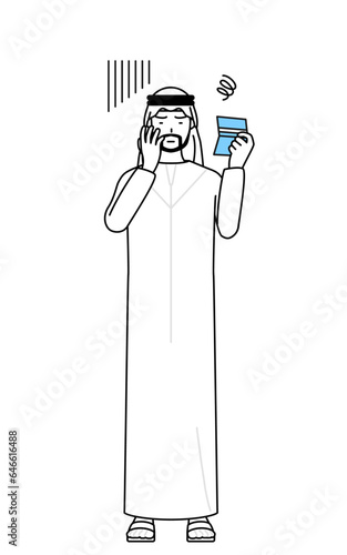 Muslim Man looking at his bankbook and feeling depressed.