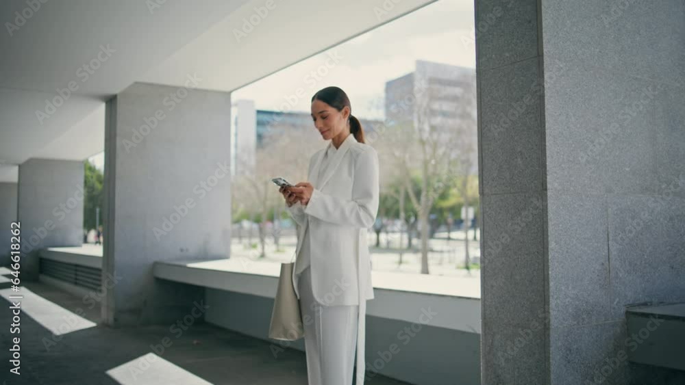 Confident lady standing office parking with smartphone closeup. Girl using phone Confident lady standing office parking with smartphone closeup. Girl using phone