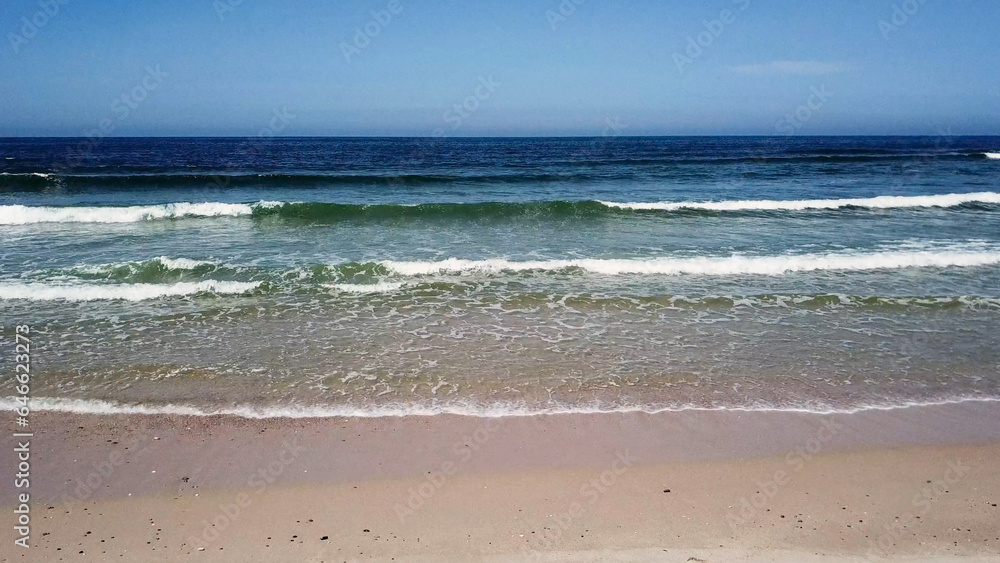 Ocean waves crashing on beach