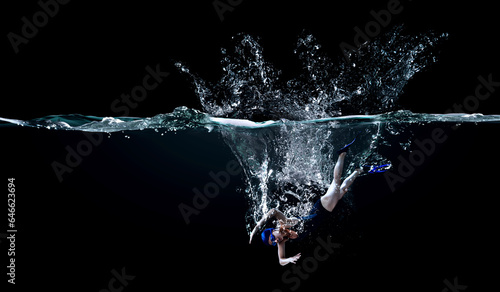 Professional woman swimmer on a wave