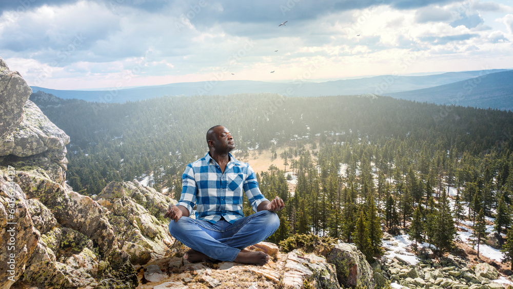 Young black man sitting and meditating