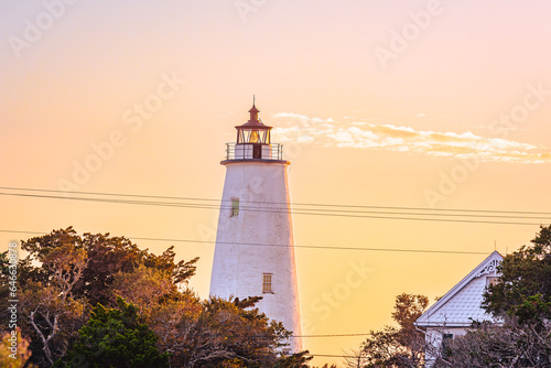 Ocracoke Lighthouse on Ocracoke Island   North Carolina at sunset.The lighthouse was built to help guide ships through Ocracoke Inlet into Pamlico Sound.