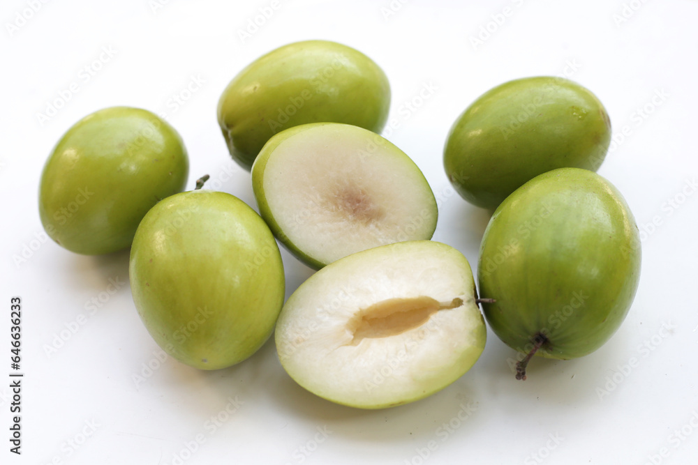 Green jujube fruits on white background. Green jujube fruits on white background.