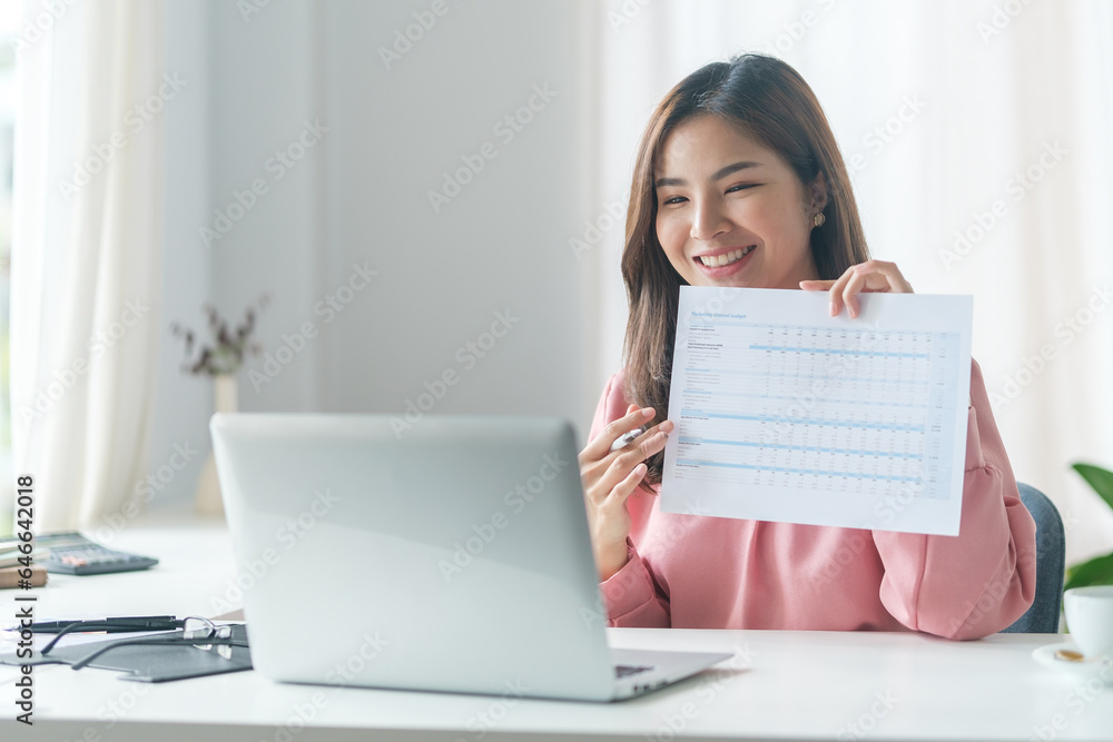 Confident businesswoman having pleasant conversation, explaining work detail on video conference with coworkers via laptop.