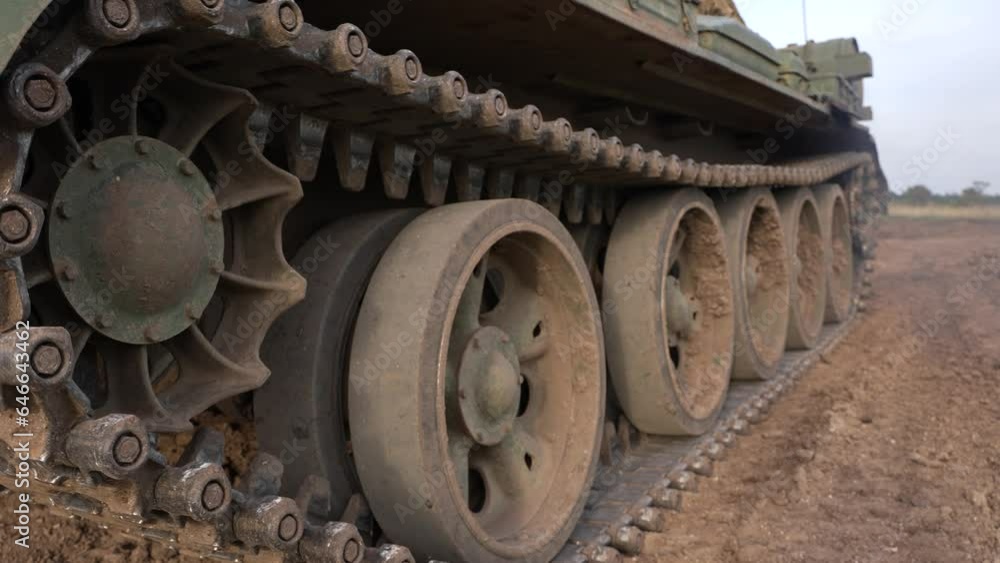 Caterpillar Tracks on a Military Tank moving ahead Caterpillar Tracks on a Military Tank moving ahead