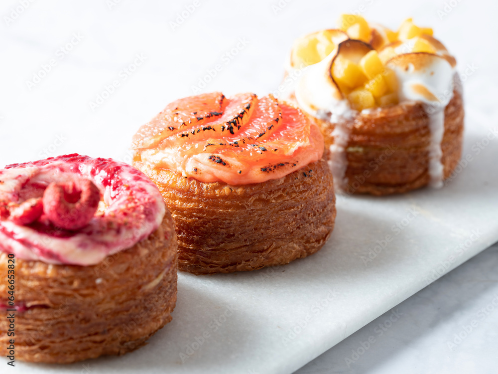 Assorted croissant donuts on a marble background Assorted croissant donuts on a marble background
