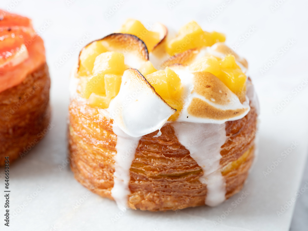 Peach croissant donuts on marble background Peach croissant donuts on marble background