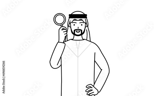 虫メガネをのぞくイスラムの男性