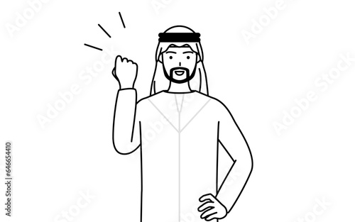 ガッツポーズをするイスラムの男性