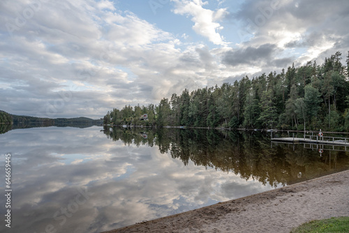 Lake Ragnerudssjoen mirror in Dalsland Sweden beautiful nature forest pinetree swedish